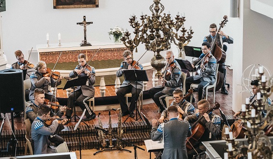 the chamber orchestra plays in the church