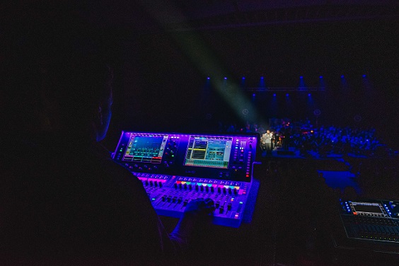 Soundman behind the mixer at a gig